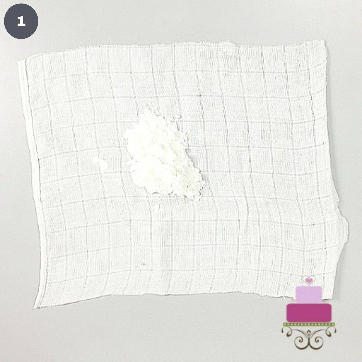 Powdered sugar in the center of a square white cloth.