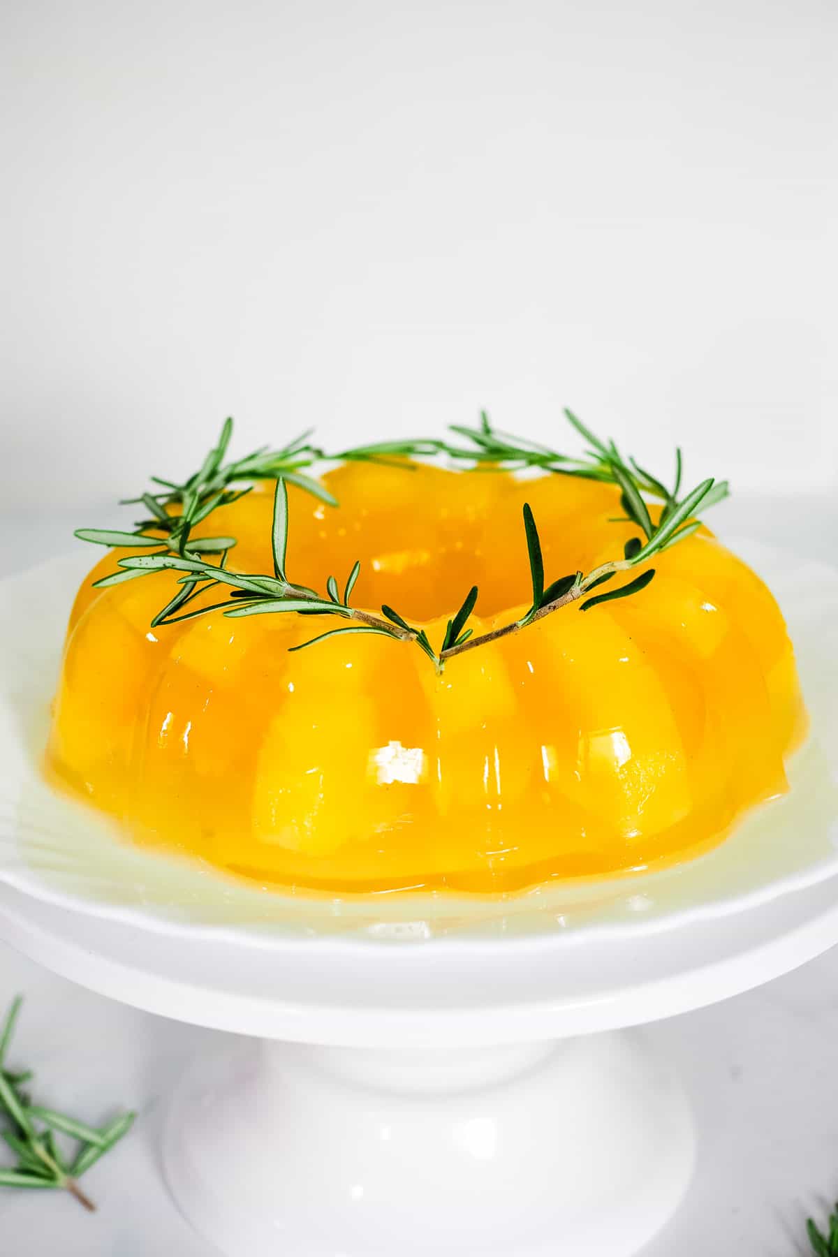 Yellow jelly on a white plate.